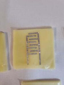Edible interdigitated capacitor on cheese